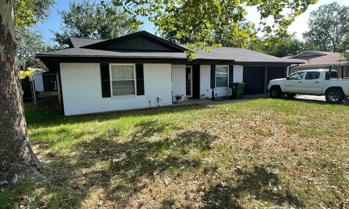 Professional roofing crew working on a residential roof in Ocean Pointe